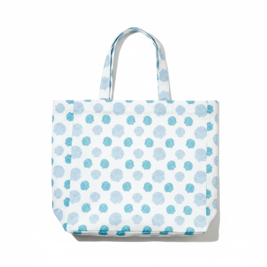 Nantucket bay scallop tote bag in eco-friendly cotton with blue coastal scallop pattern