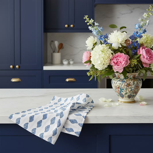 Tarpon Bay tulip shells tea towel in French linen cotton with blue striped shell pattern